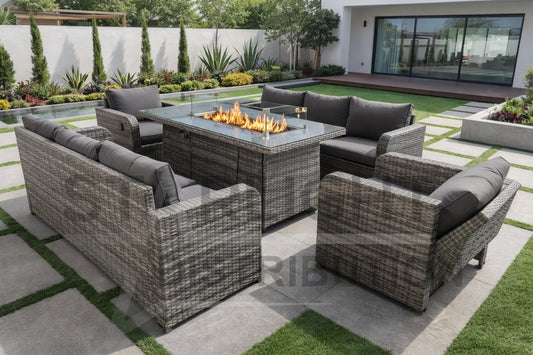 Outdoor patio furniture set with a fire pit table in a modern back garden setting.